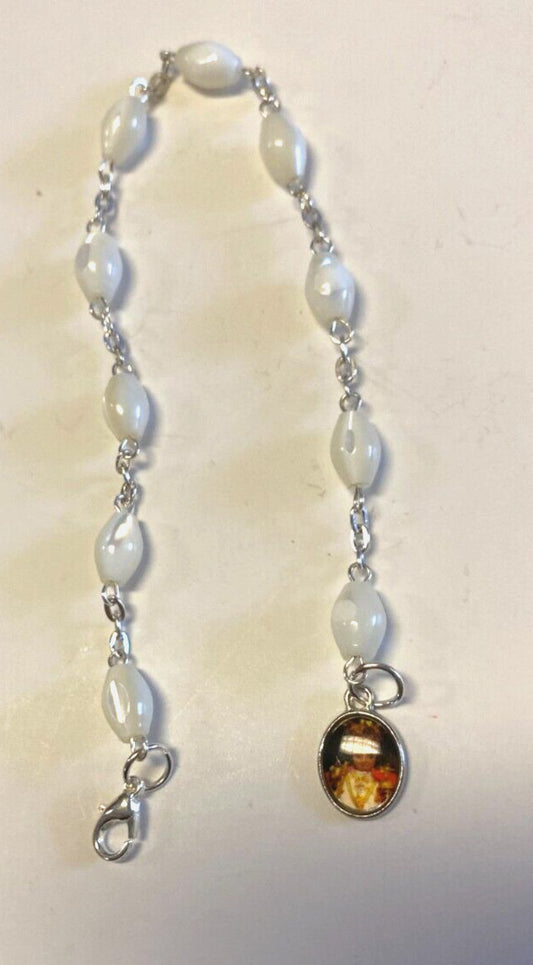 Infant of Prague charm bracelet with a decade rosary beads, Christian jewelry by Bob and Penny Lord, featuring religious religious symbolism.