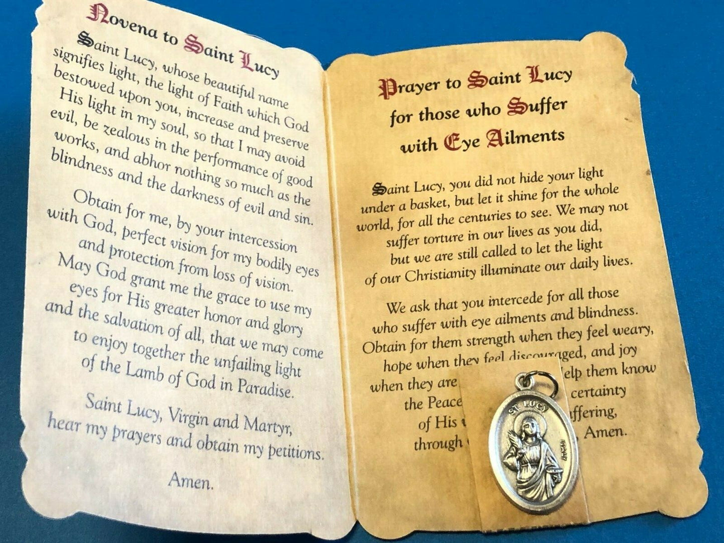 Saint Lucy novena card with medal, Christian holy card featuring religious imagery and prayer, by Bob and Penny Lord.