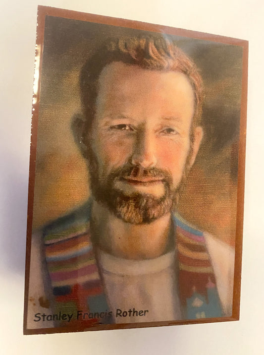 Wood rosary box with Christian rosary inside, featuring religious design, from Bob and Penny Lord, representing St. Francis Rother.