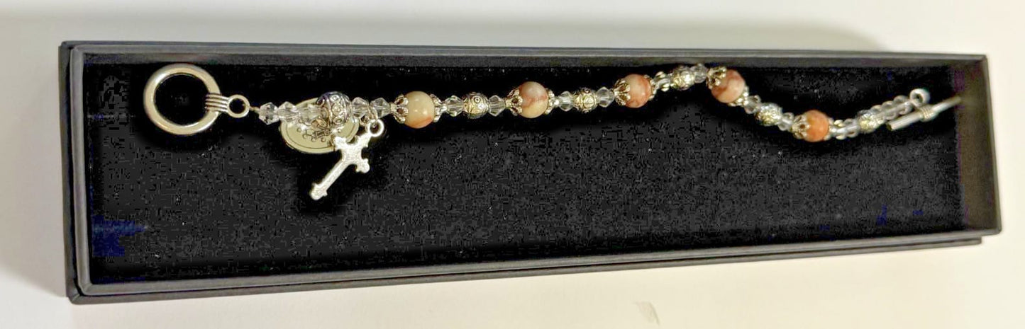 Light brown Madonna del Parto Miraculous Medal bracelet featuring religious jewelry from Journeys of Faith, with detailed pendant and beads.