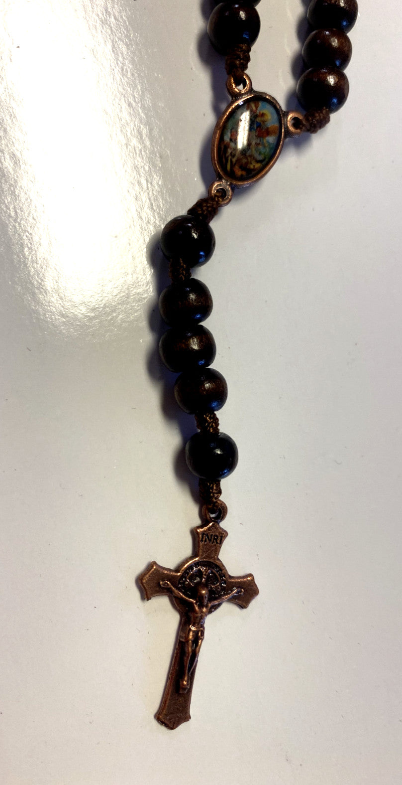 Wood rosary box with St. Michael the Archangel design and rosary, handcrafted spiritual collectible from Colombia by Bob and Penny Lord.
