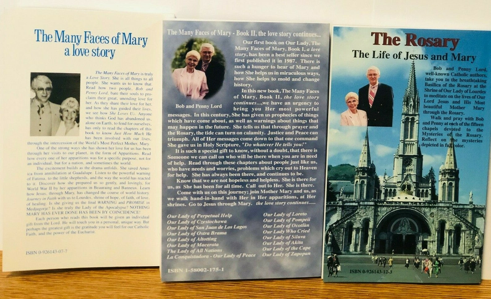 Photo of The Many Faces of Mary Books 1 & II by Bob and Penny Lord, featuring religious books about Mary, Jesus, and the Rosary.