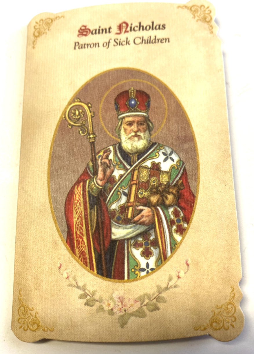 Saint Nicholas prayer folder with medal, Christian Holy Card from Bob and Penny Lord, featuring religious imagery of the Patron Saint of Children.