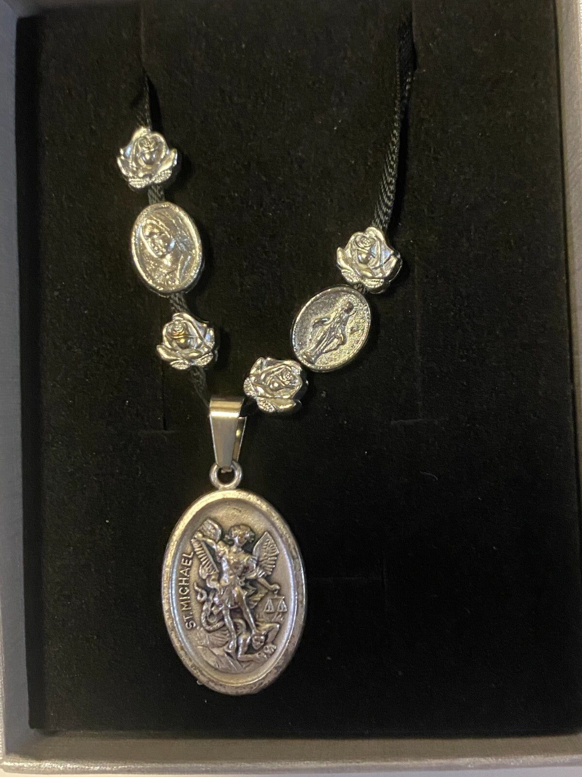 Art print of St. Michael, Divine Mercy, Miraculous Medal, and Our Lady Guadalupe ribbon necklace by Journeys of Faith.