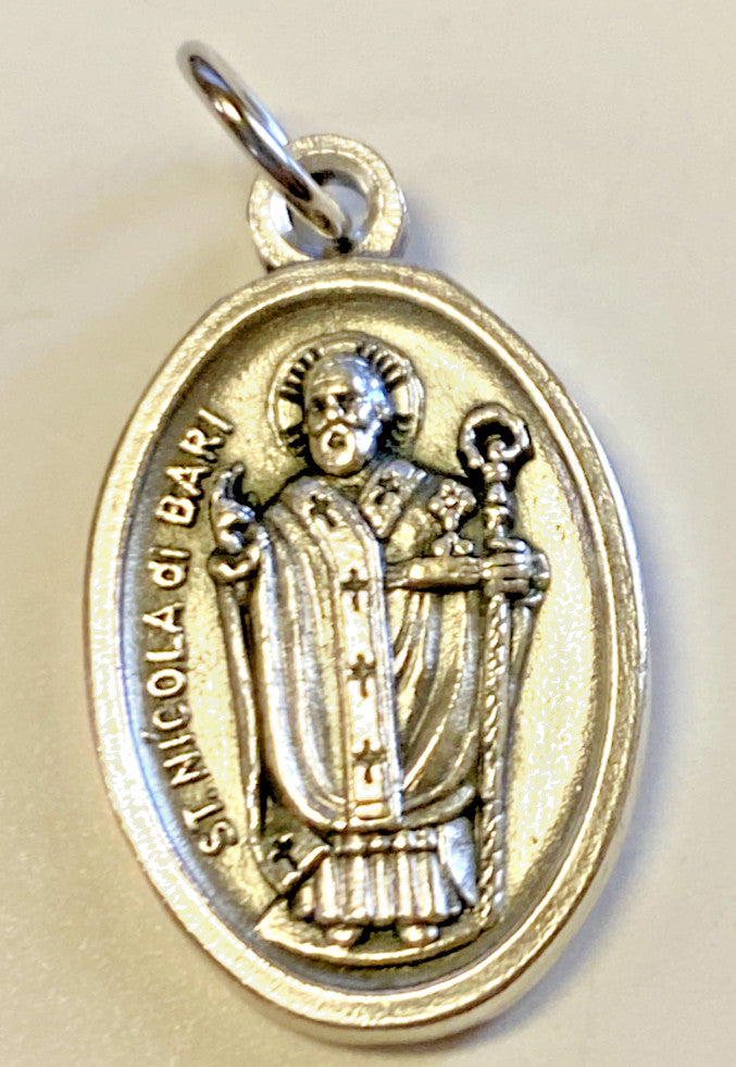 Saint Nicholas prayer folder and medal from Bob and Penny Lord, religious Christian collectible featuring Holy Card imagery.