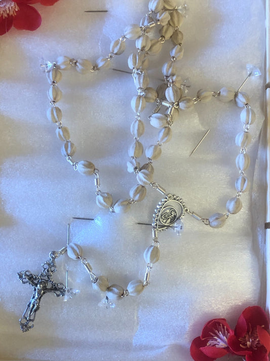 Saint Clare of Montefalco rosary by Bob and Penny Lord Journeys of Faith, featuring beaded strands and religious medals.