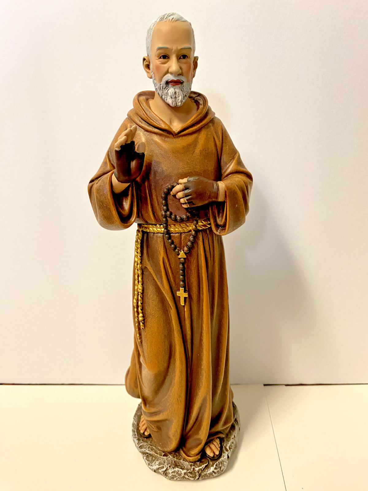 Padre Pio 10.25-inch religious statue by Bob and Penny Lord, detailed Christian figurine for collectibles and spiritual decor.