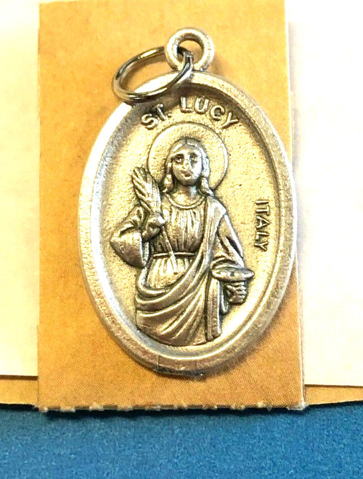 Saint Lucy Novena card with medal, religious Christian Holy Card featuring Saint Lucy, patron of eye ailments, by Bob and Penny Lord.