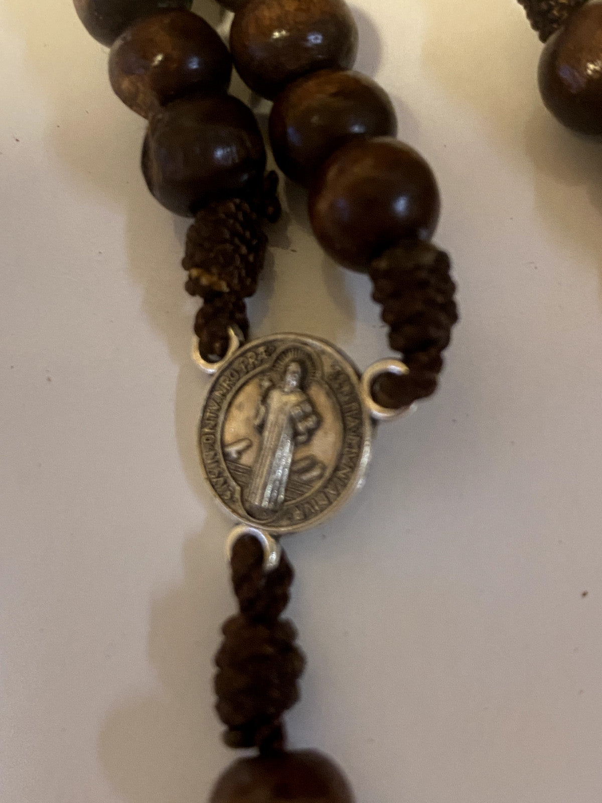 Wood rosary box with Saint Sister Faustina design and a Catholic rosary inside, crafted by Bob and Penny Lord from Colombia.