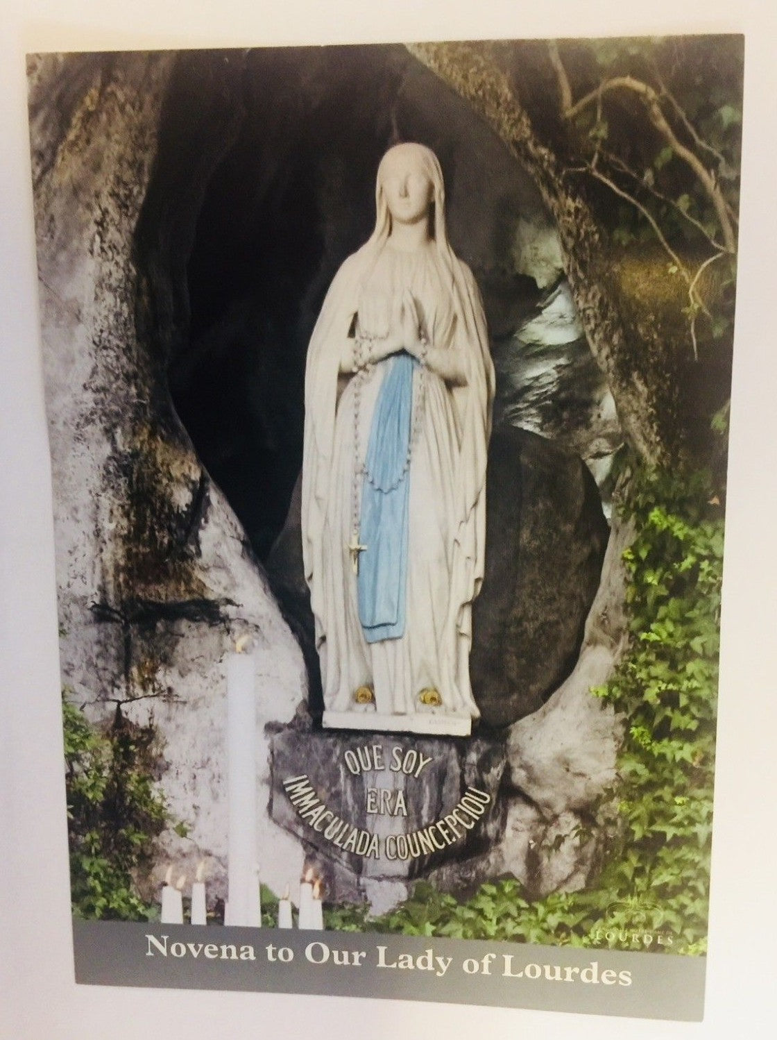 Our Lady of Lourdes novena holy card by Bob and Penny Lord, featuring religious imagery and Christian symbolism.