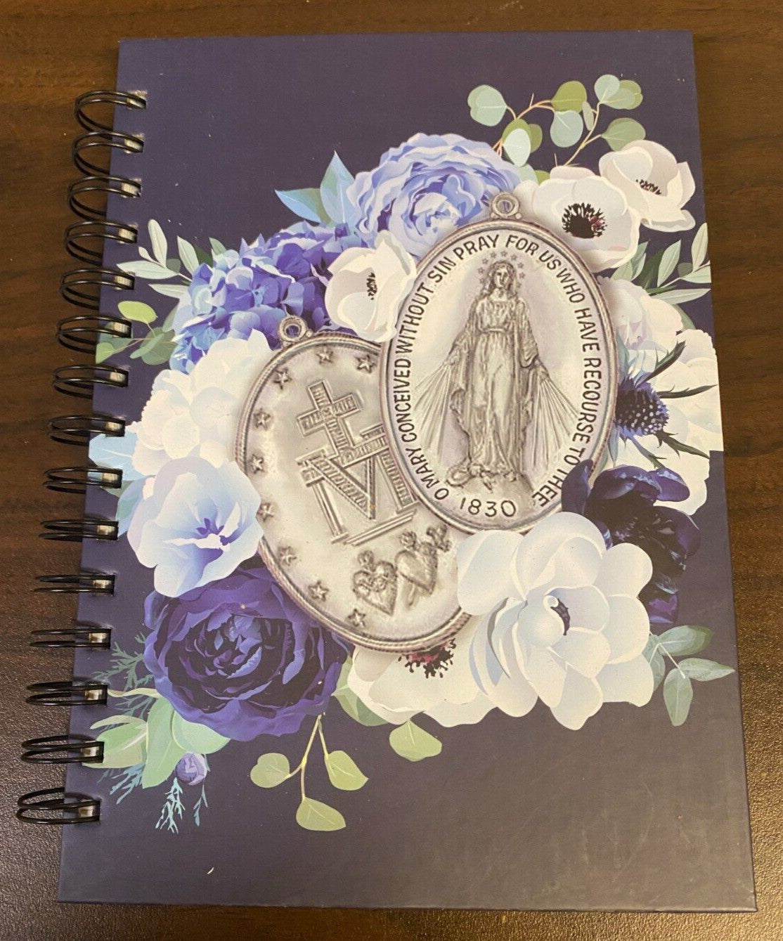 Hardcover journal featuring Our Lady of the Miraculous Medal with religious imagery, by Bob and Penny Lord, ideal for spiritual reflection.