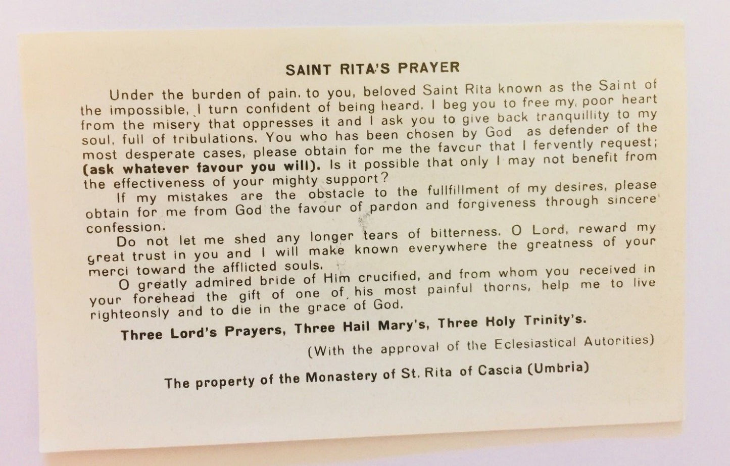 Saint Rita of Cascia prayer card from Bob and Penny Lord featuring religious imagery and devotional design.