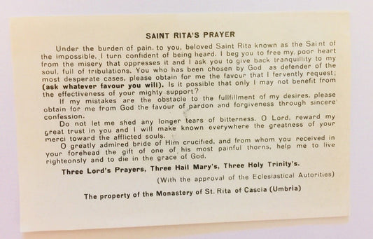 Saint Rita of Cascia prayer card from Bob and Penny Lord featuring religious imagery and devotional design.