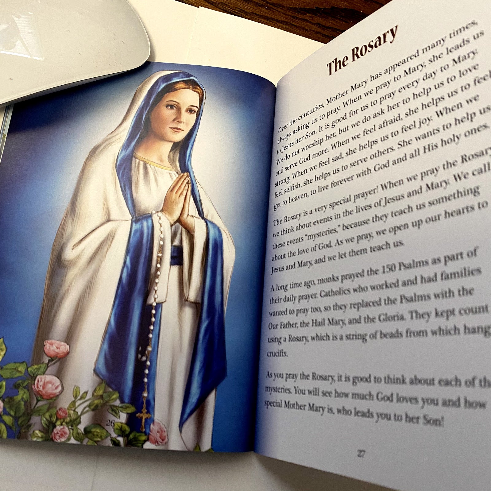 Paperback book titled "The Apparitions of Mary" by Bob and Penny Lord, featuring spiritual imagery and Christian themes.
