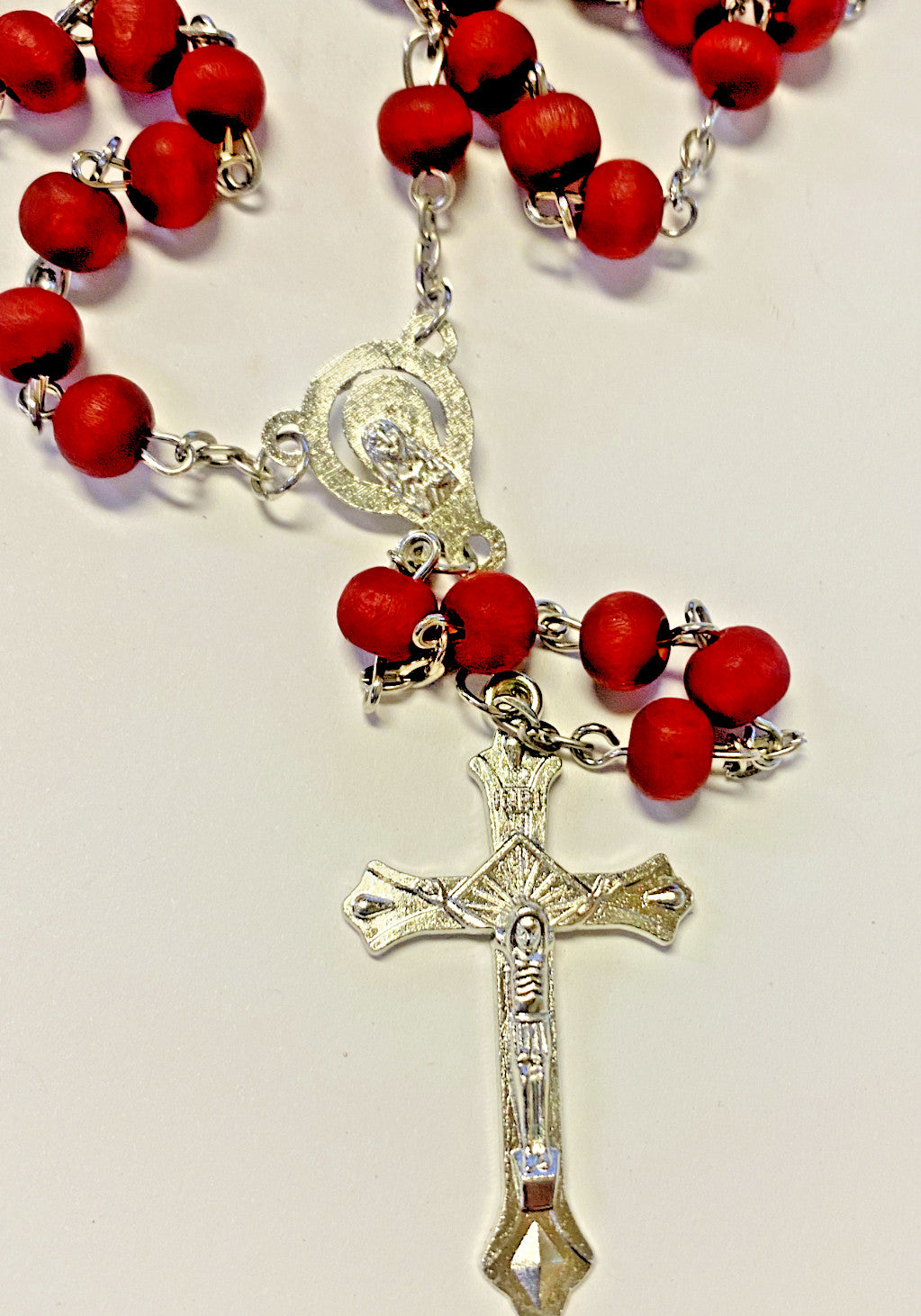 Lady of Guadalupe rose-scented rosary by Bob and Penny Lord, featuring religious beads and a detailed image of Our Lady of Guadalupe.