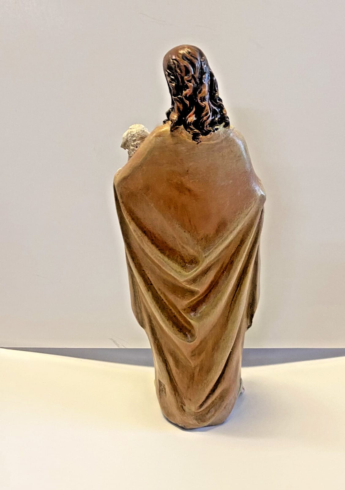 Resin statue of the Good Shepherd, 4-inch collectible by Journeys of Faith, depicting a shepherd figure in prayer.