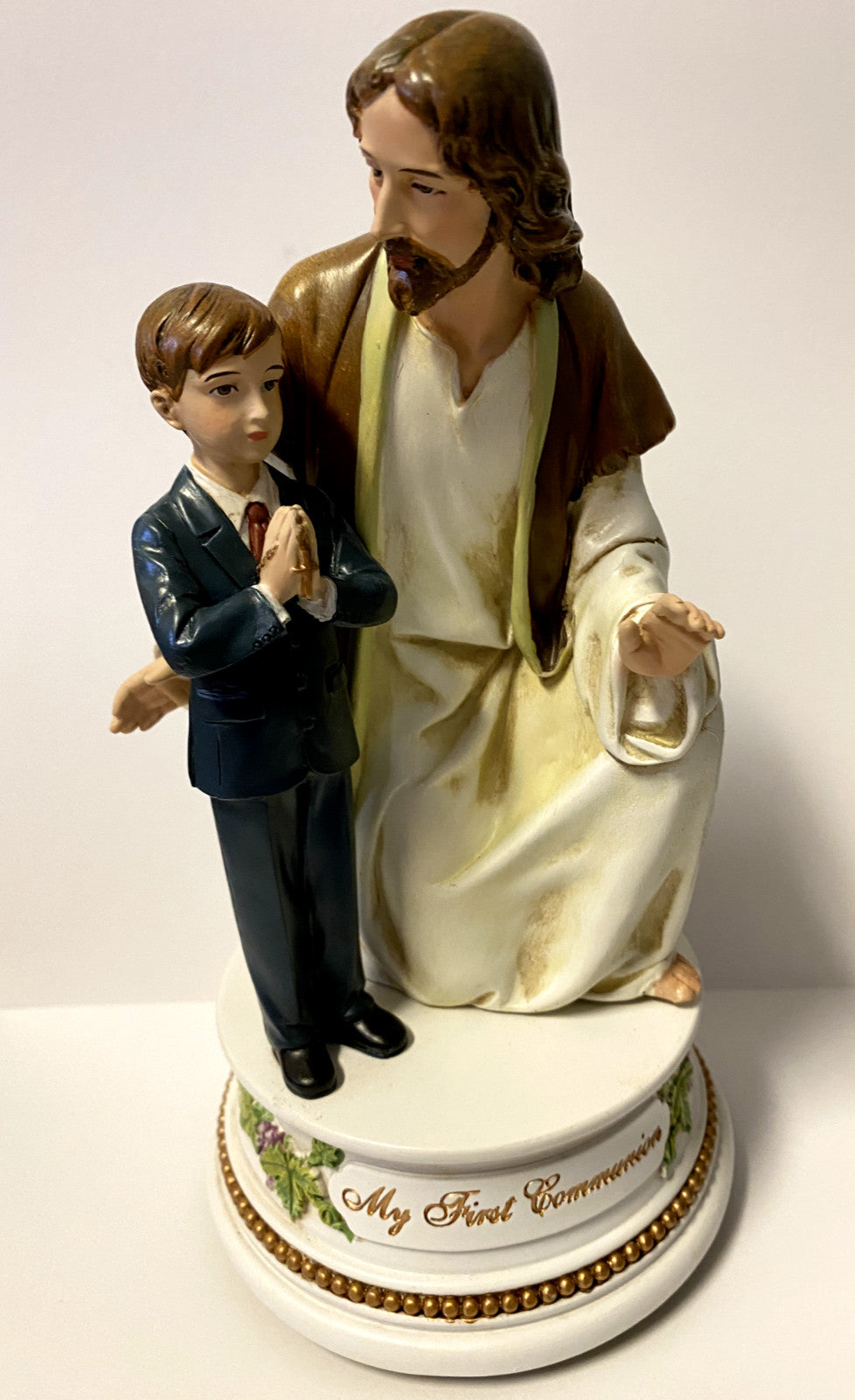 Roman Jesus with Boy Communion musical figurine, 7.25-inch ceramic sculpture depicting religious scene for home décor.