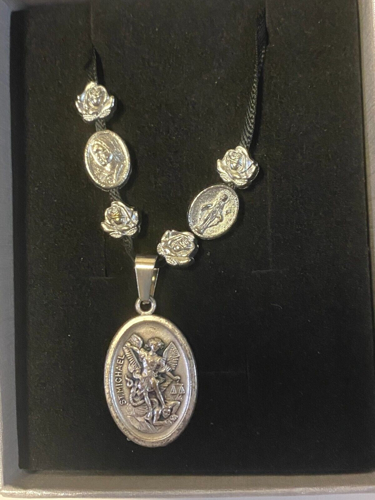 Art print of St. Michael, Divine Mercy, Miraculous Medal, and Our Lady Guadalupe ribbon necklace by Journeys of Faith.
