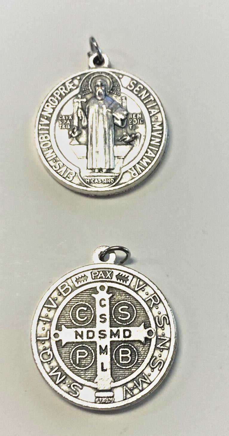 Silver tone Saint Benedict medal by Bob and Penny Lord, featuring religious symbols, new collectible Christian medal.