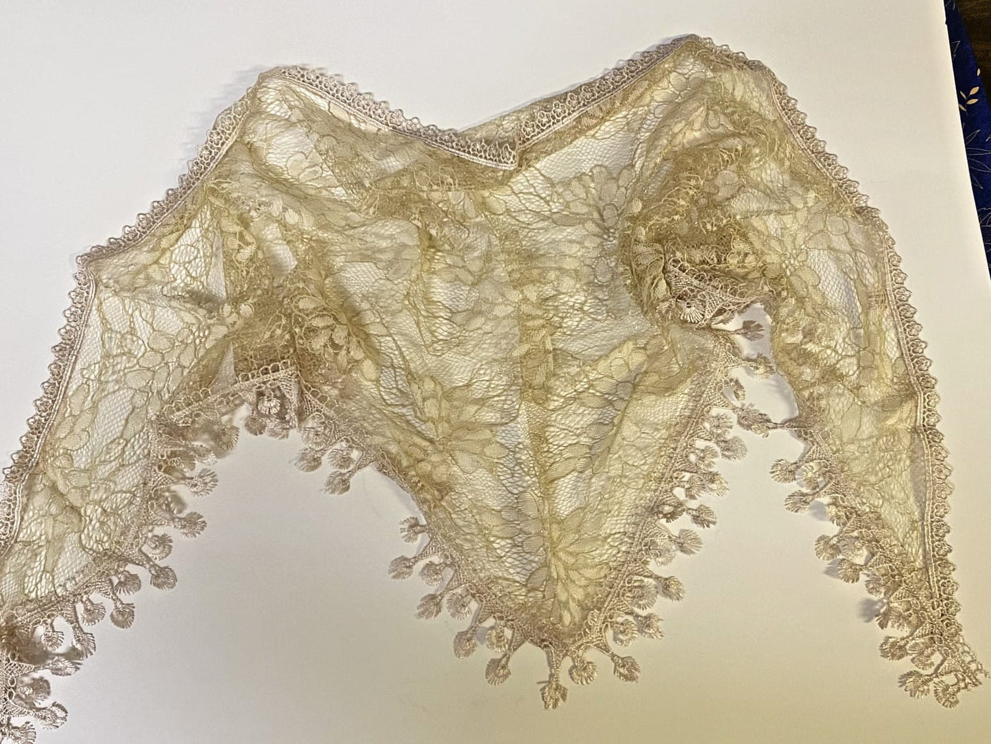 Light khaki lace church veil for women, elegant accessory with delicate lace details, suitable for special occasions or religious events.