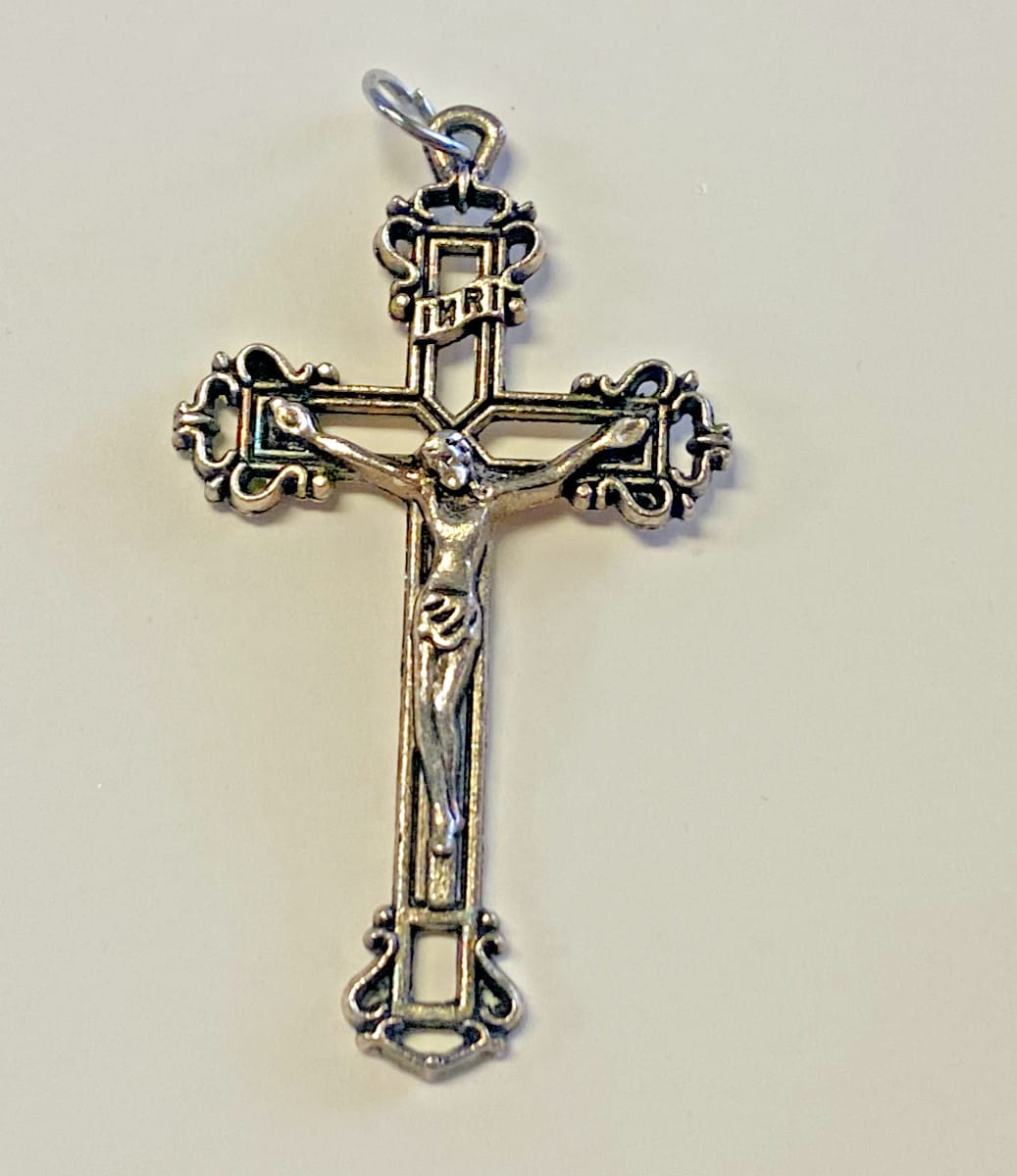 Ornate crucifix pendant by Journeys of Faith featuring intricate Christian cross design, hanging from a detailed chain.