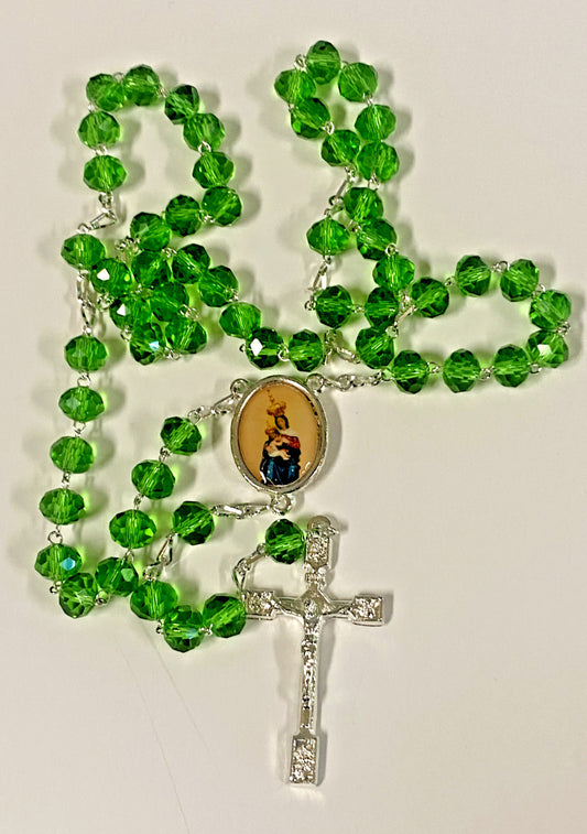 Handmade green Our Lady of Mount Carmel rosary with beads and crucifix, crafted by Bob and Penny Lord, from Colombia.