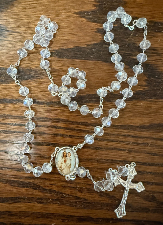Handmade iridescent beads rosary with cross, crafted by Bob and Penny Lord, featuring vibrant beads from Colombia.