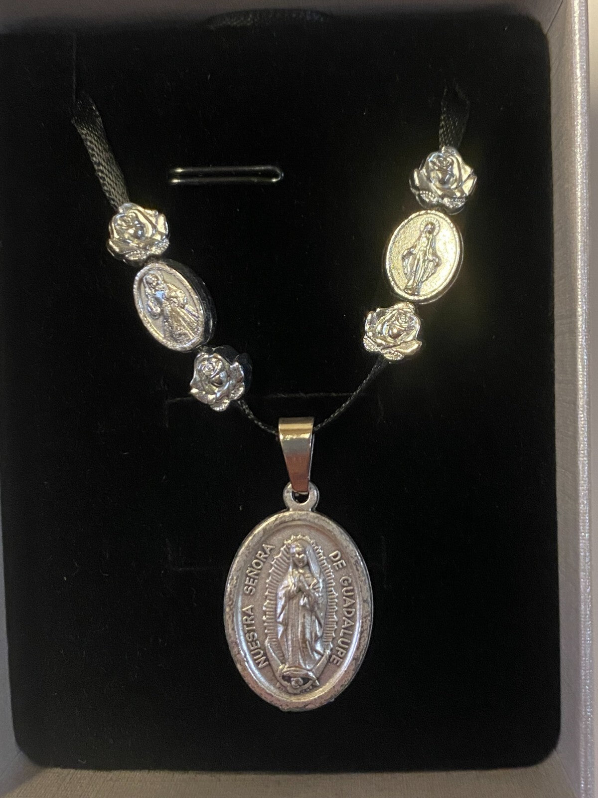 Art print of St. Michael, Divine Mercy, Miraculous Medal, and Our Lady Guadalupe ribbon necklace by Journeys of Faith.