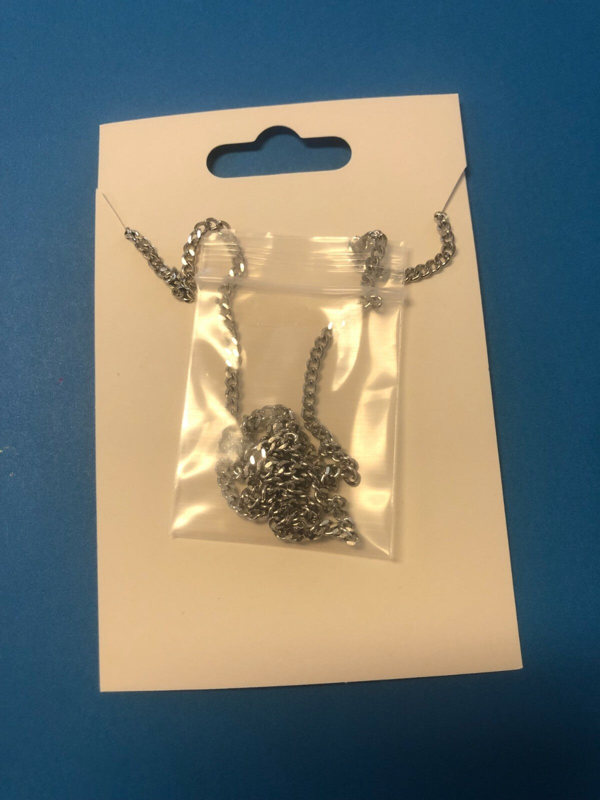 Berkander 24-inch curb endless stainless steel chain necklace for fashion jewelry, showcasing its sleek, polished design.