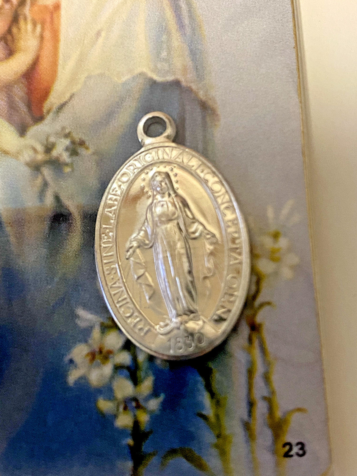 Blessed Mother image card with 1-inch medal, Christian religious collectible from Bob and Penny Lord, featuring a sacred image and medallion.