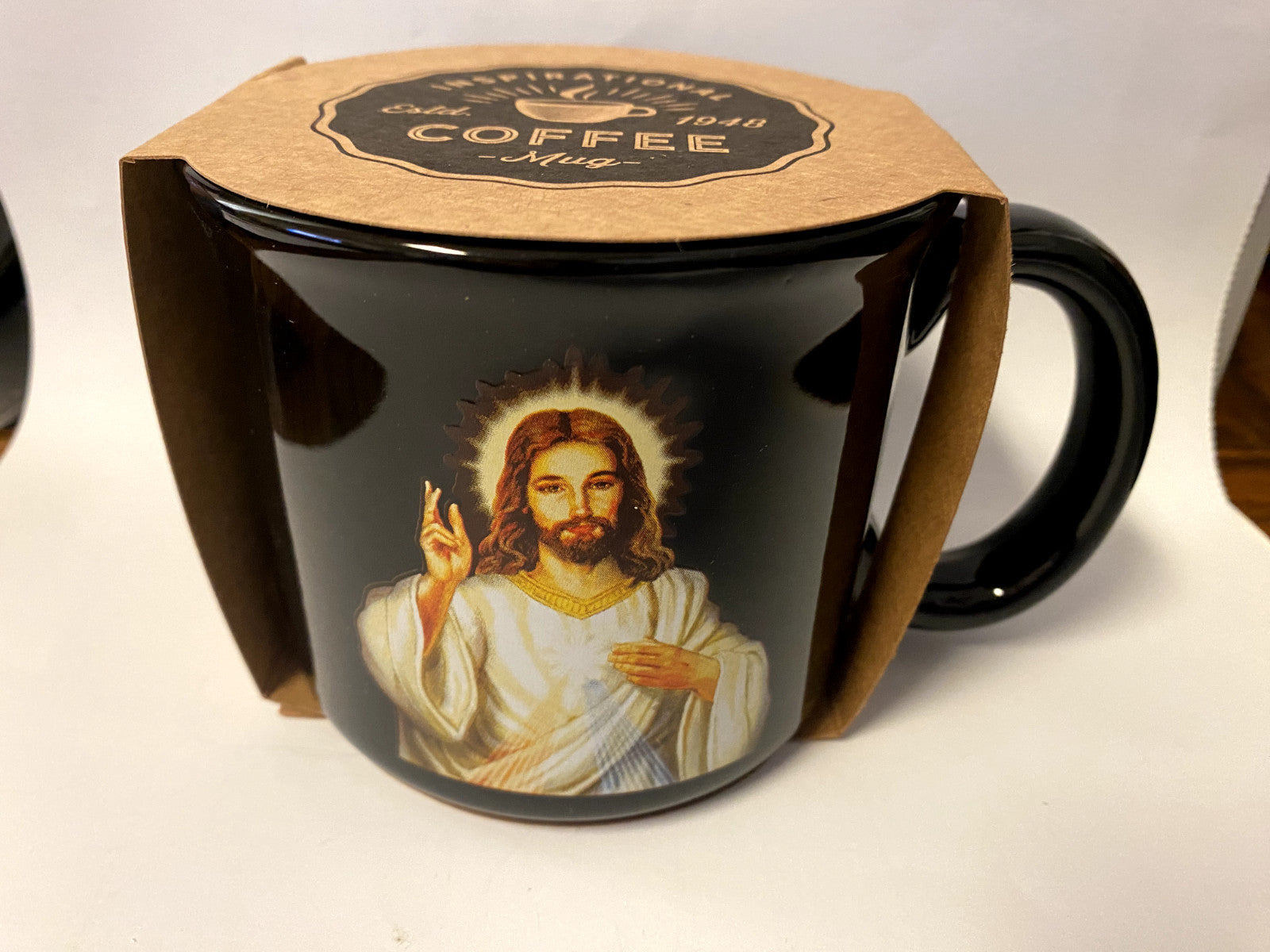 Divine Mercy Black 13 oz ceramic mug featuring Christian religious design and Divine Mercy chaplet, by Bob and Penny Lord.