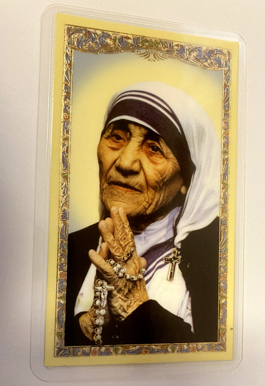 Laminated prayer card featuring Saint Mother Teresa of Calcutta with religious imagery and inspiring message, by Bob and Penny Lord.