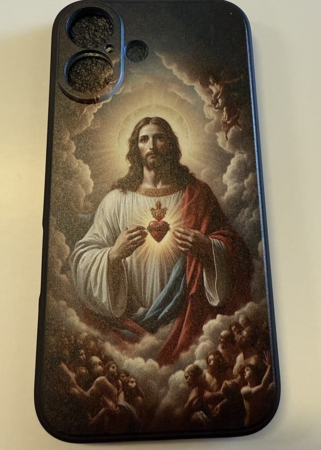 Sacred Heart of Jesus iPhone 16 case by New Case, decorative phone cover with religious design and vibrant colors.