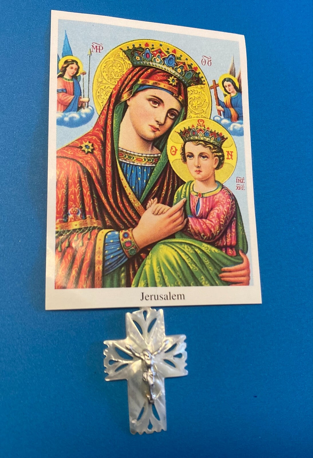 Image of Our Lady of Perpetual Help religious print with a Mother of Pearl Crucifix Pendant by Bob and Penny Lord.