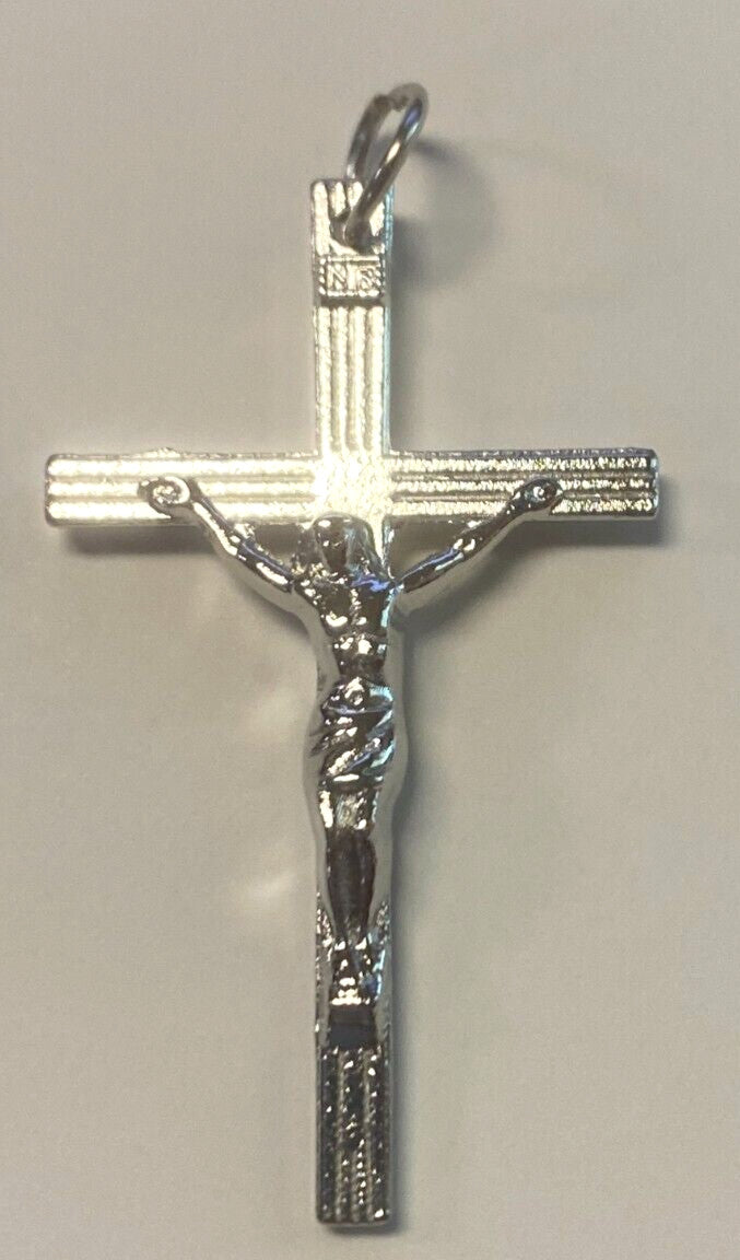 Silver plated 1.75-inch crucifix pendant featuring intricate Christian cross design, from Bob and Penny Lord collectibles.