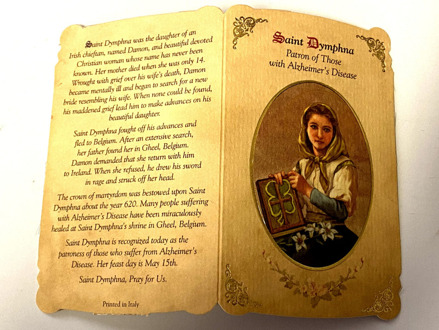 Saint Dymphna prayer card and medal from Italy, Christian Holy Card featuring religious imagery and detailed medal design.