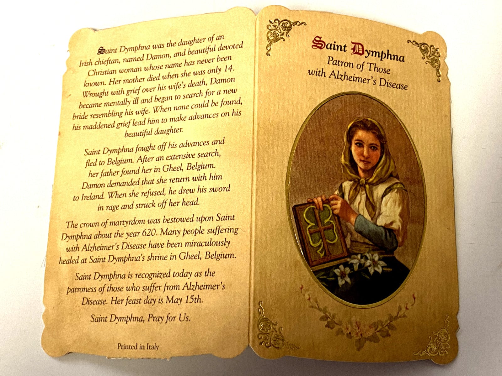 Saint Dymphna prayer card and medal from Italy, Christian Holy Card featuring religious imagery and detailed medal design.