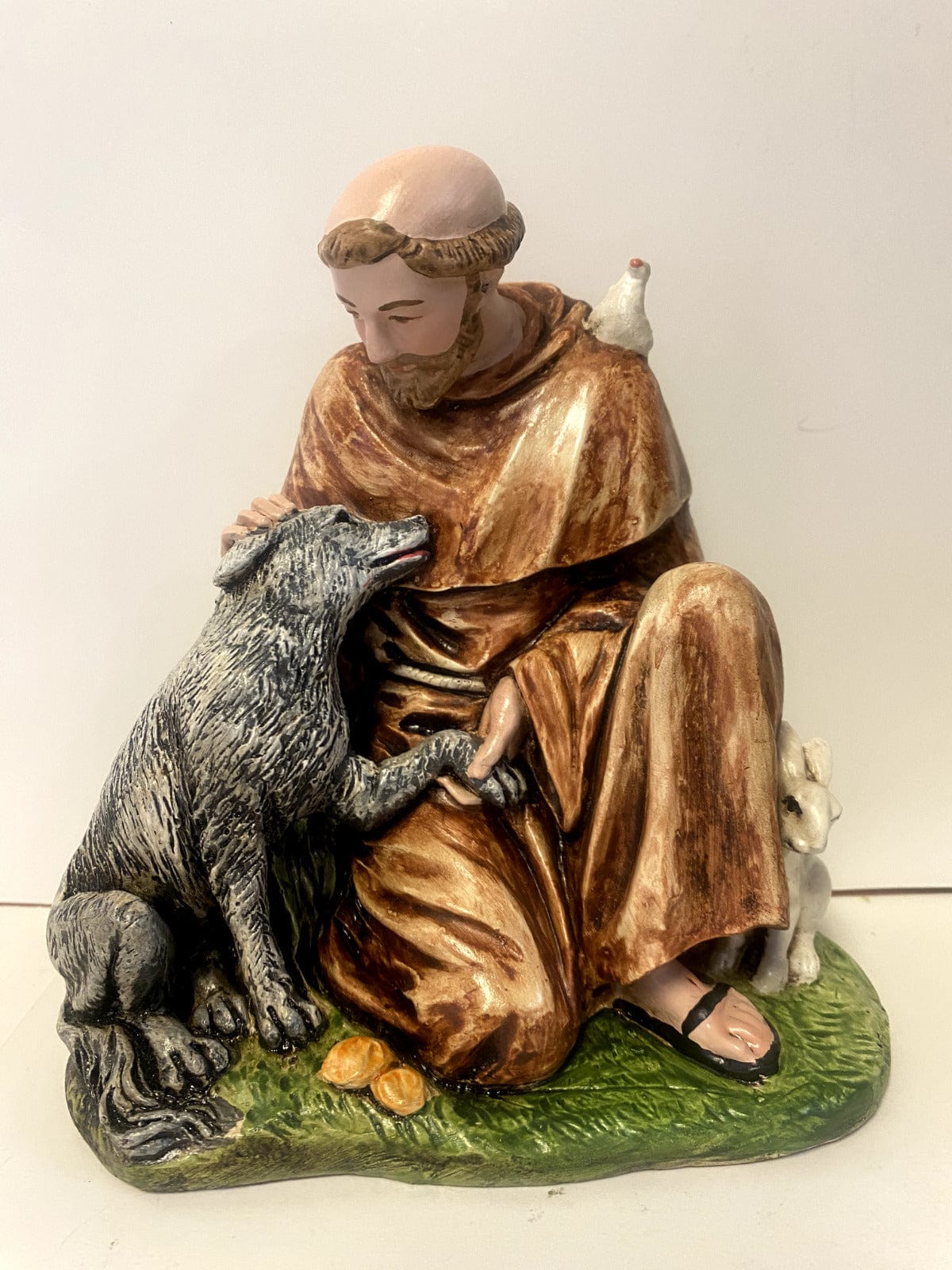Saint Francis of Assisi with wolf 6.5-inch collectible statue by Bob and Penny Lord, depicting Saint Francis with a wolf in detailed craftsmanship.