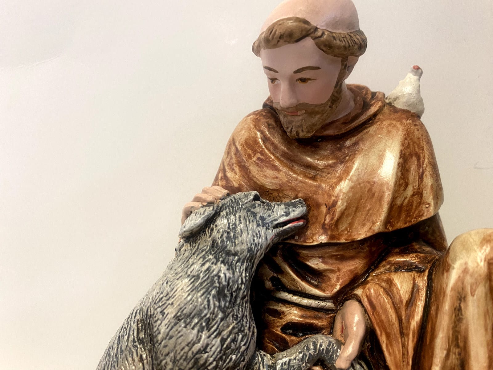 Saint Francis of Assisi with wolf 6.5-inch collectible statue by Bob and Penny Lord, depicting Saint with wolf in religious art style.