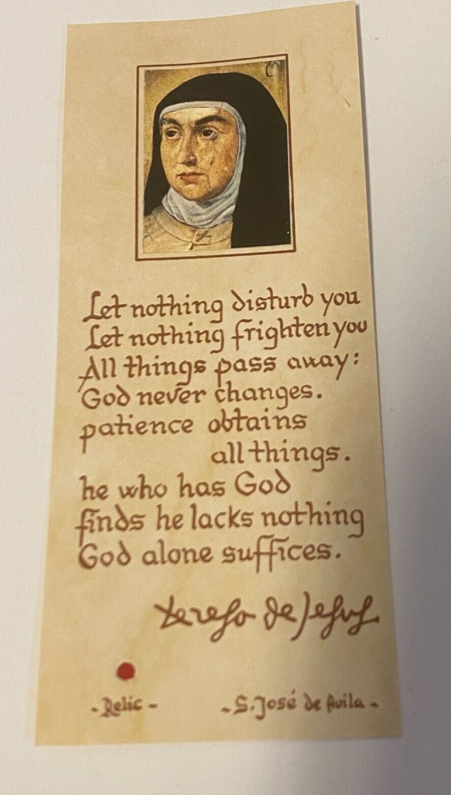 Saint Teresa of Avila prayer card with relic from Spain, featuring religious imagery and relic encapsulation, by Bob and Penny Lord.