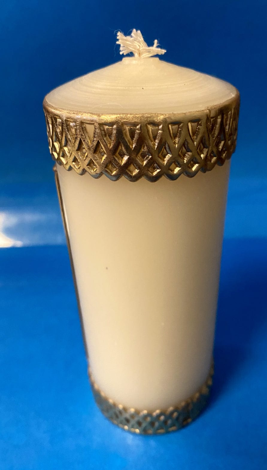 Small devotional candle by Will & Baumer featuring Saint Peregrine's image, ideal for home prayer and spiritual ambiance.