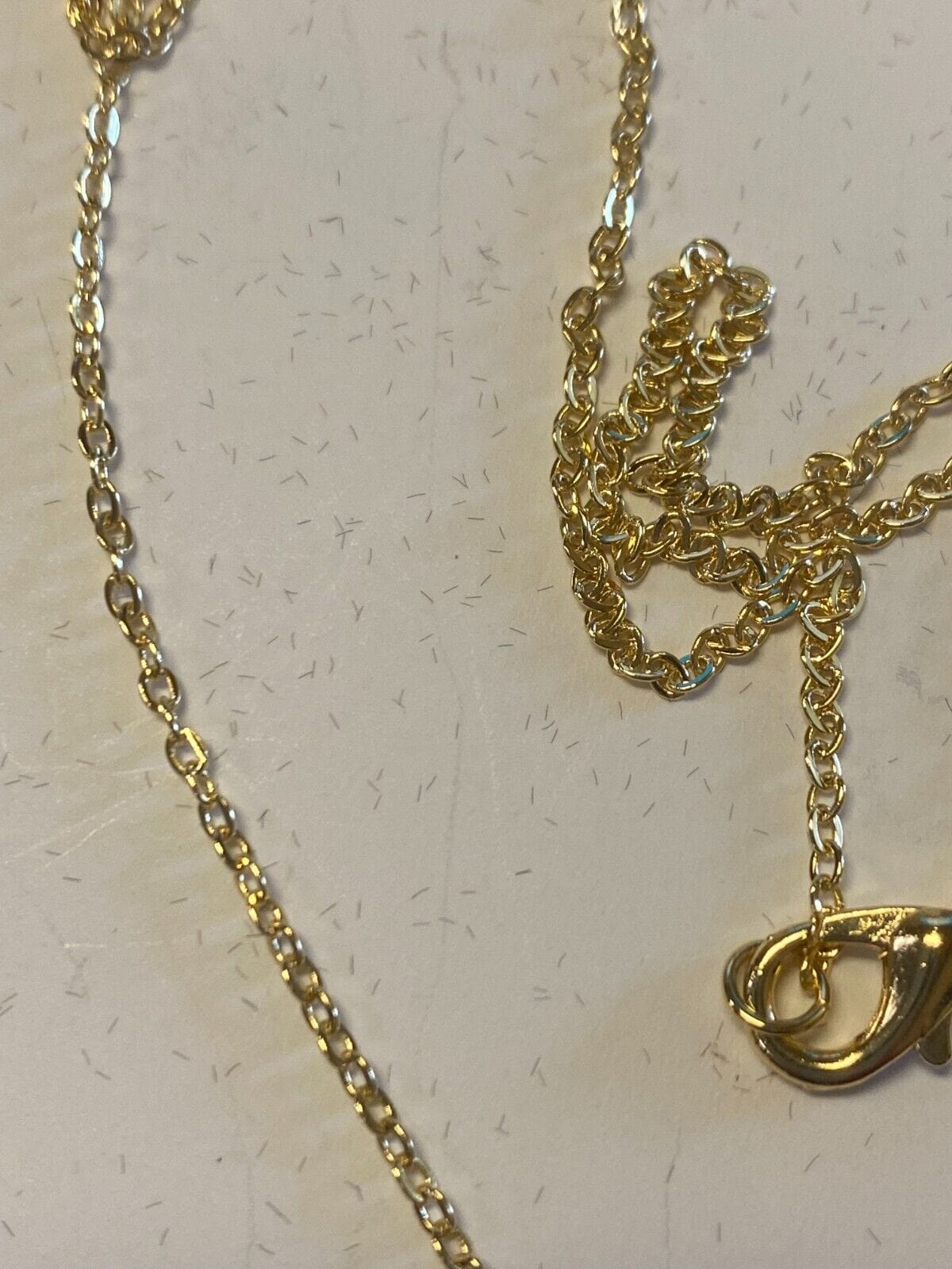 Brazilian gold-plated Blessed Mother necklace, 20-inch fashion jewelry pendant with religious design and intricate details.