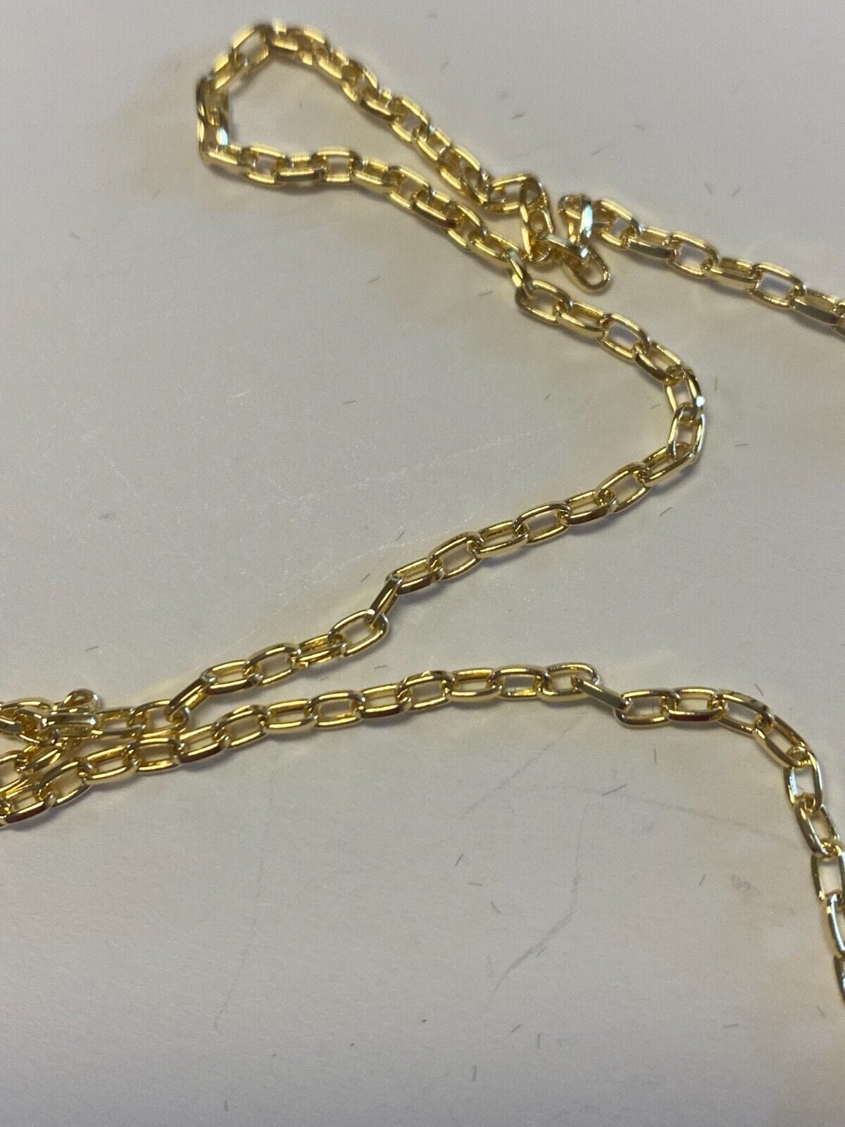 Brazilian gold-plated crucifix necklace, 20-inch fashion jewelry with detailed pendant and chain, stylish and elegant accessory