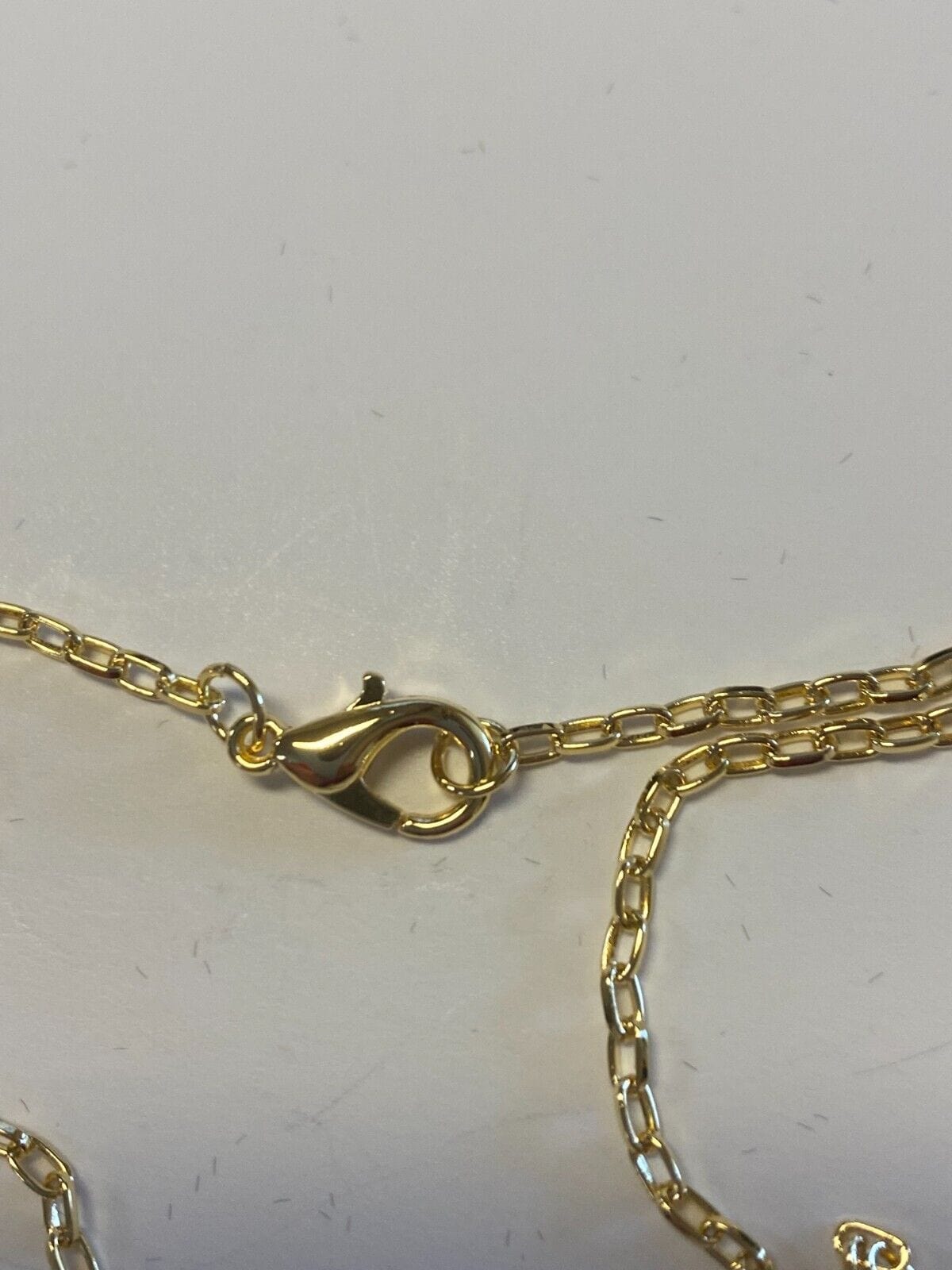 Brazilian gold-plated crucifix necklace, 20-inch fashion jewelry pendant on a chain, perfect for religious or stylish accessories.