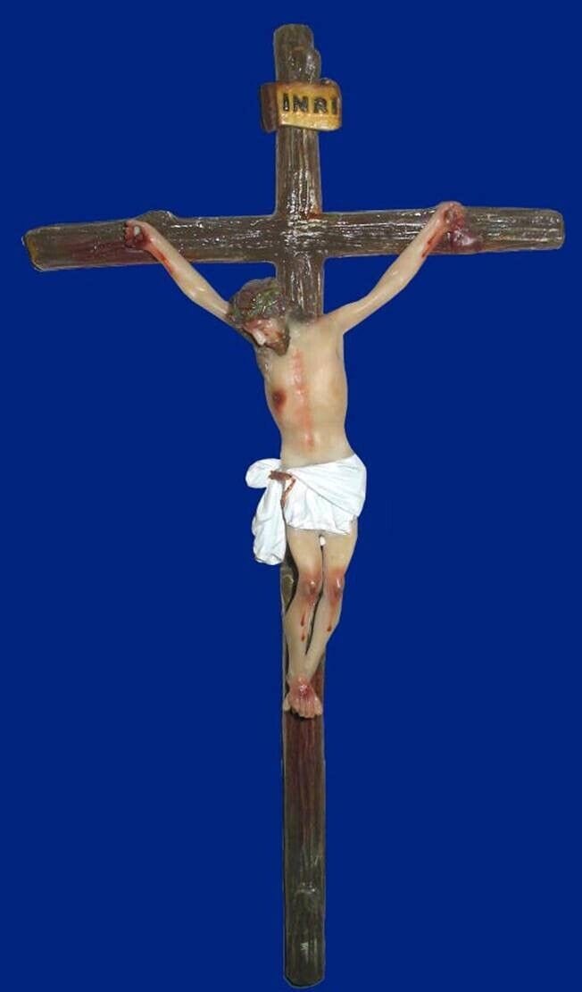 Handmade 11-inch wooden crucifix from Colombia by Bob and Penny Lord, featuring detailed religious craftsmanship.