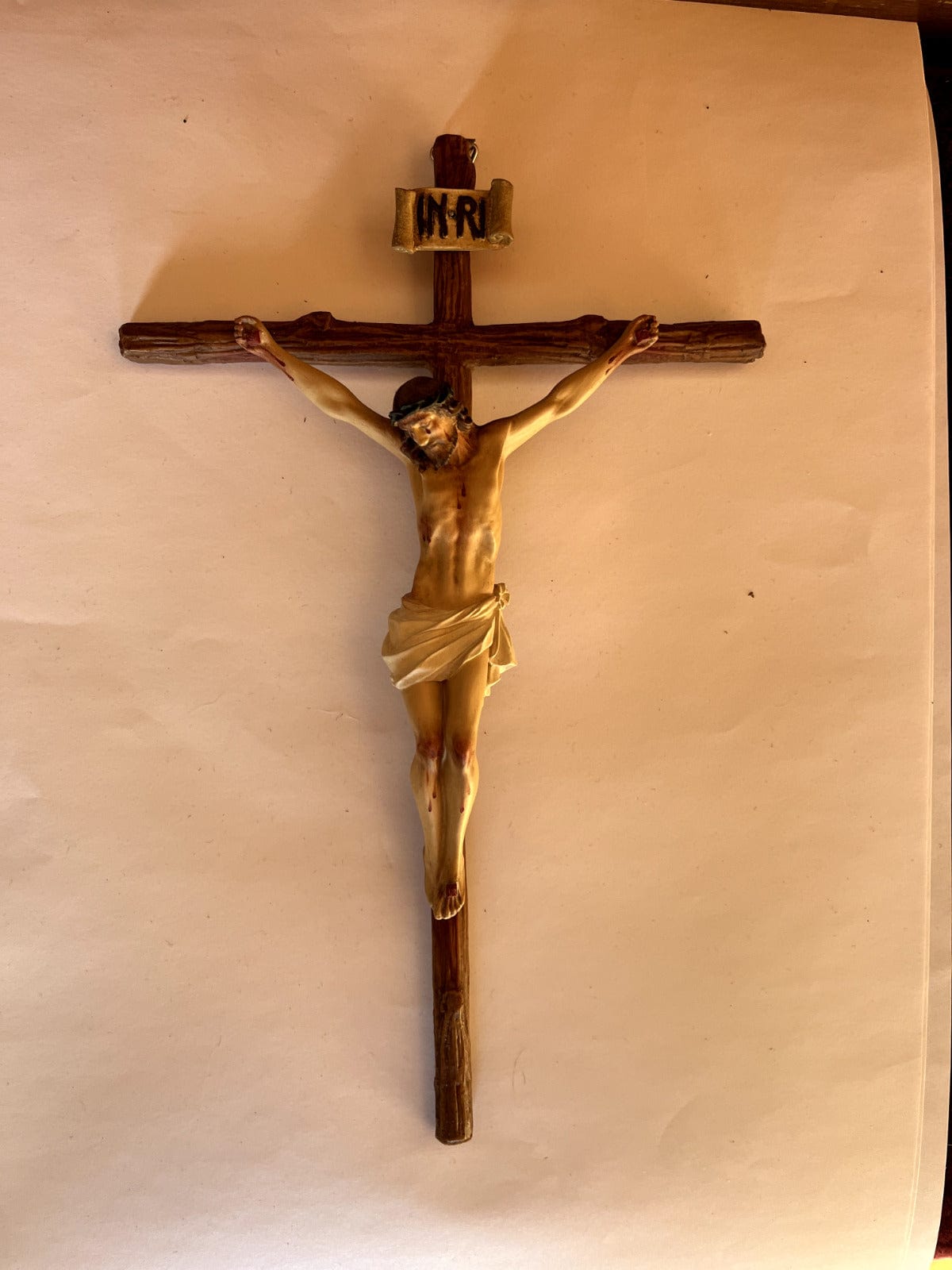 Handmade 11-inch wooden crucifix from Colombia featuring detailed religious craftsmanship, part of Christian collectibles by Bob and Penny Lord.