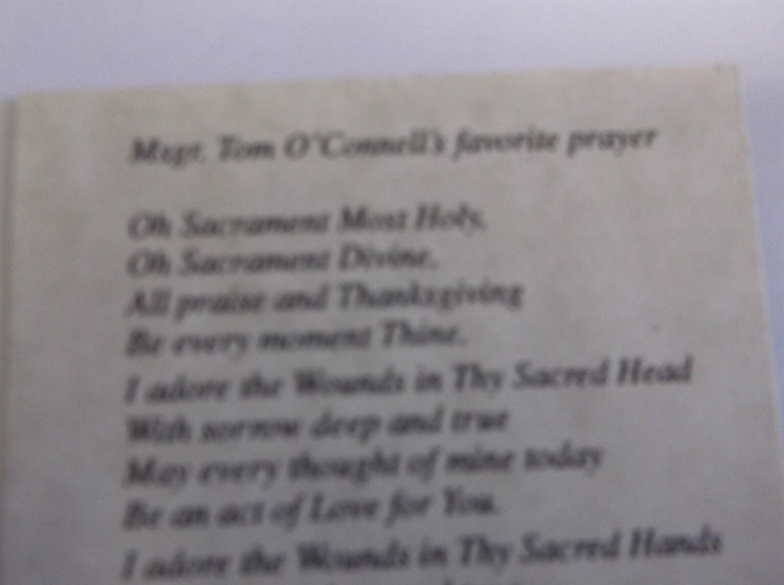 Holy cards featuring Eucharistic Prayer After Communion, produced by Bob and Penny Lord, displayed with detailed religious artwork.
