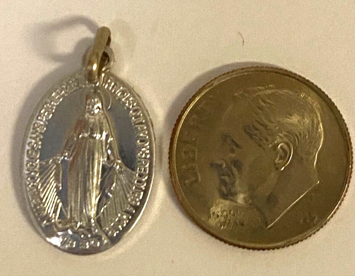 Our Lady of the Miraculous Medal folder featuring religious imagery and history, from Bob and Penny Lord, with a medal included.