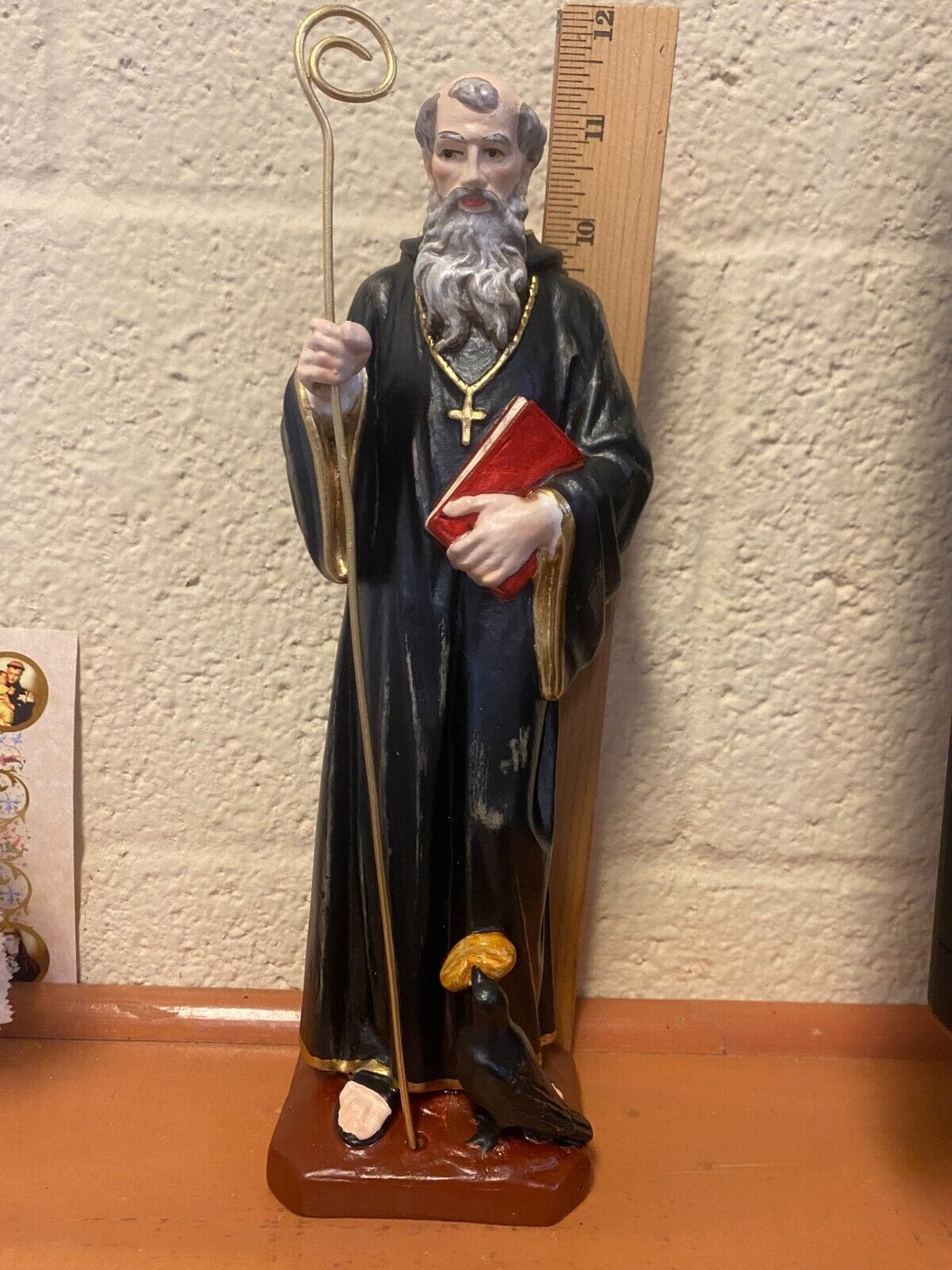 Hand-painted 11-inch Saint Benedict statue by Bob and Penny Lord, displayed on a neutral background, showcasing detailed religious craftsmanship.