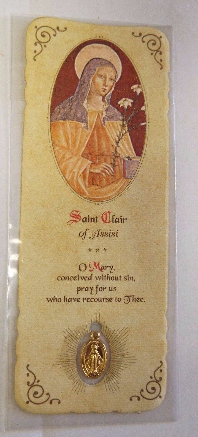 Saint Clare of Assisi prayer card with medal, religious Christian Holy Card from Bob and Penny Lord, featuring detailed artwork and design.